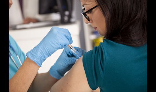 Woman getting vaccine